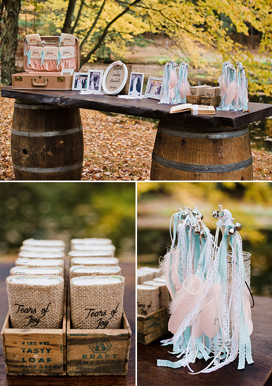 Rustic wedding decor with feathers and tears of joy bags