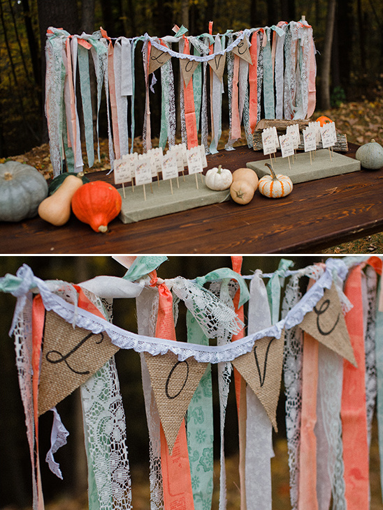 Rustic wedding decor with ribbon backdrop and pumpkins