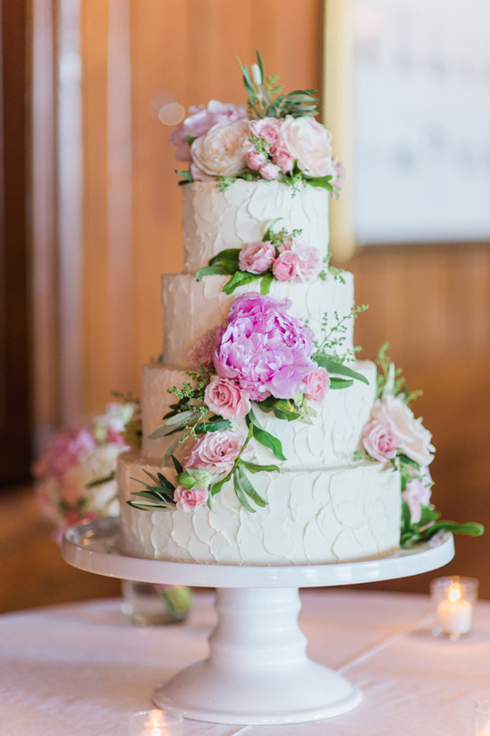 flower topped cake by Branching Out Cakes