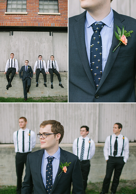 suited up groom with groomsmen in suspenders