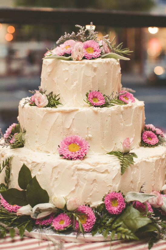 pink flower accented wedding cake from Windfall Market