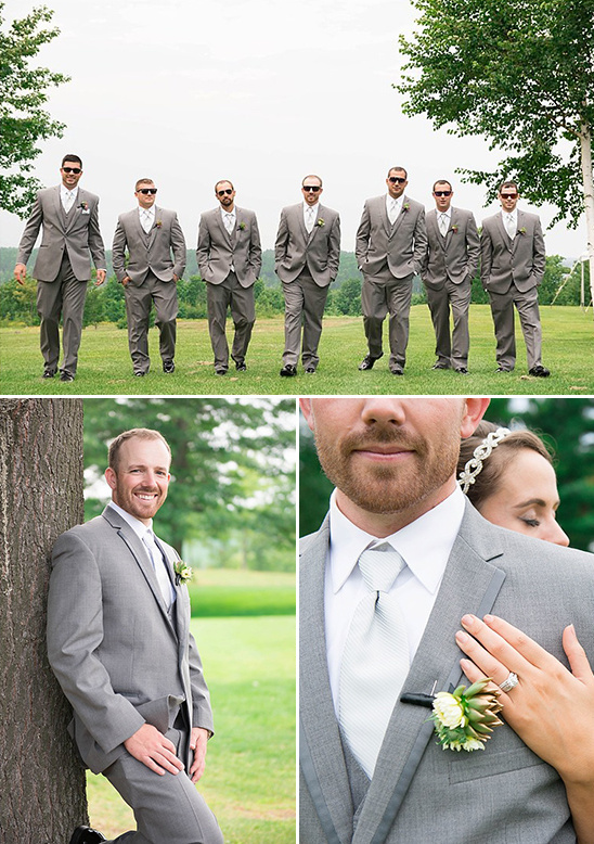 Wedding party in gray suits looking stylish on the grass