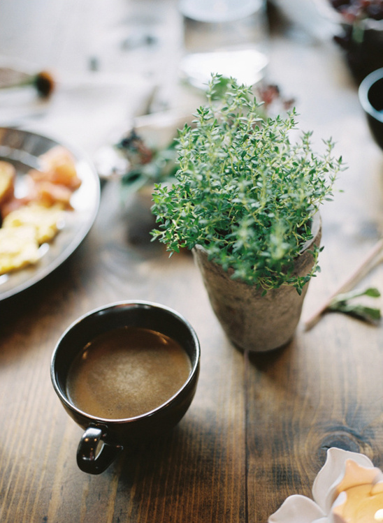 Coffee thyme and snacks on a rustic wooden table