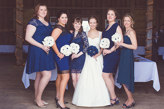 Bride and bridesmaids in blue dresses barn wedding