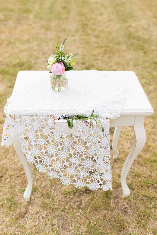 delicate lace covered wedding altar