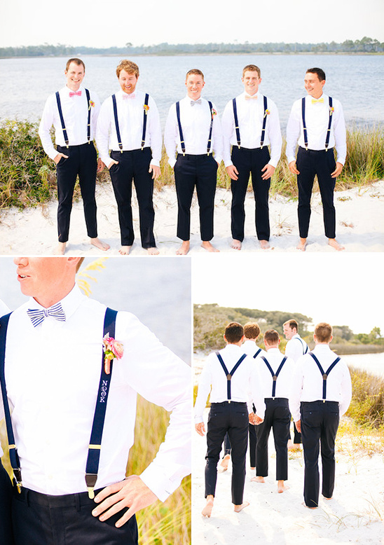 Happy groomsmen in suspenders and bow ties beach wedding