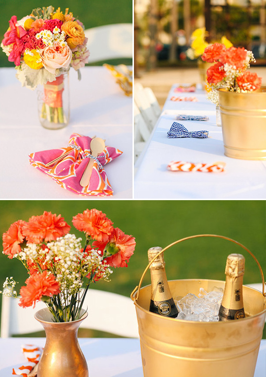 Wedding table with colorful flowers and champagne bucket