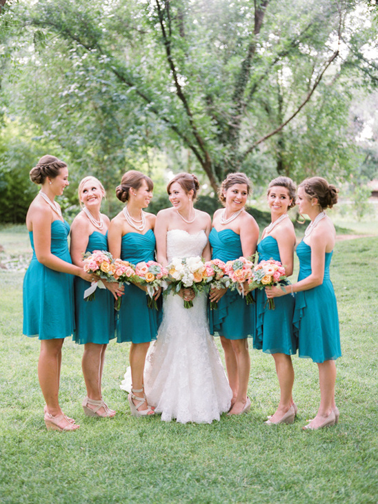Bride and bridesmaids in teal dresses outdoor wedding