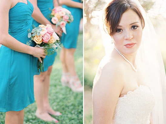 Bride with bridesmaids in blue dresses holding bouquets