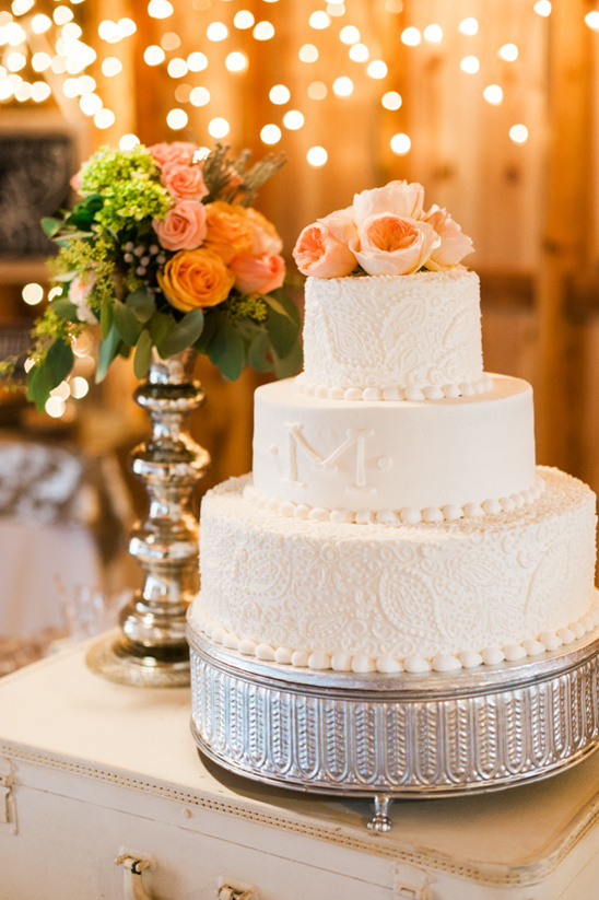 Elegant three tiered wedding cake with floral decorations