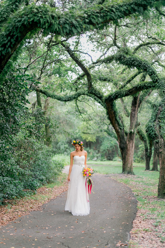 Bride in white dress in natural park setting