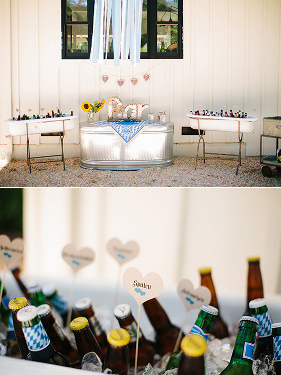 Outdoor wedding bar setup with bathtubs and beer