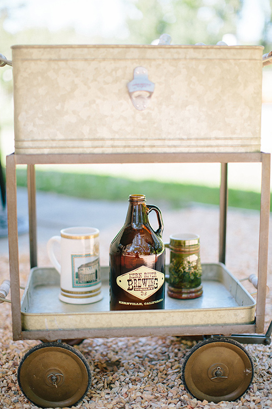 Rustic beer cart with Kern River Brewing growler