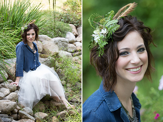 Beautiful woman with feather and flower crown smiling