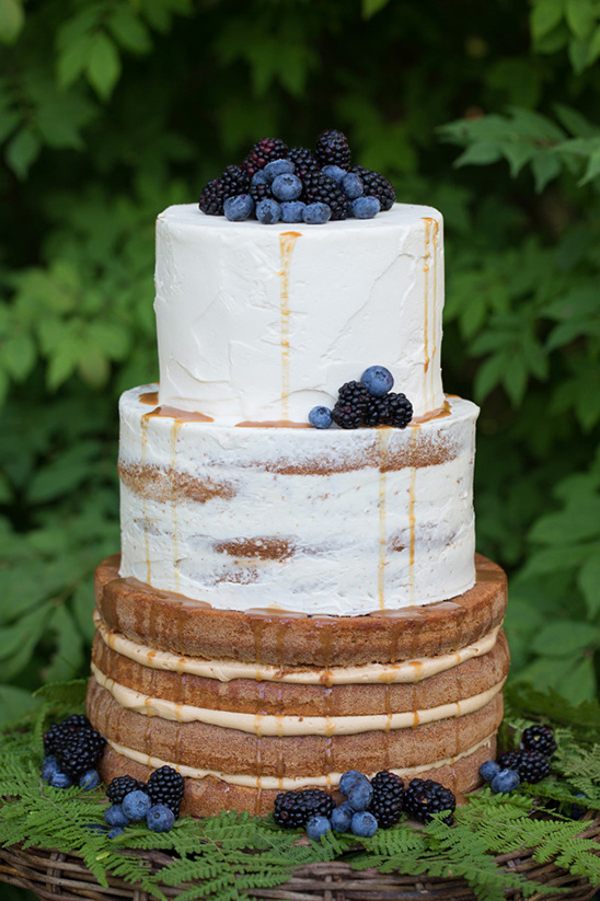 Delicious three tier naked cake with fresh berries