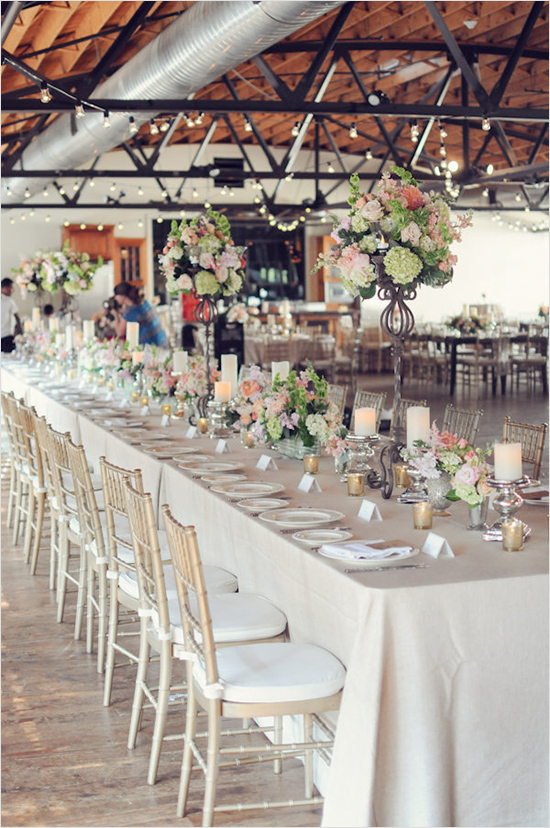 Elegant wedding reception table with floral centerpieces