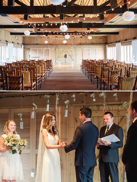 Wedding ceremony in a rustic barn setting with happy couple