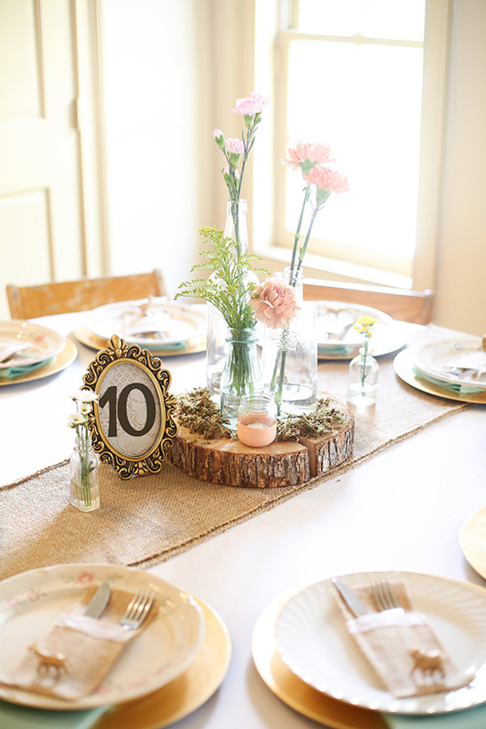framed table number and rustic centerpiece
