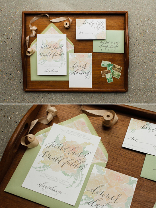 Elegant wedding invitations on a wooden serving tray