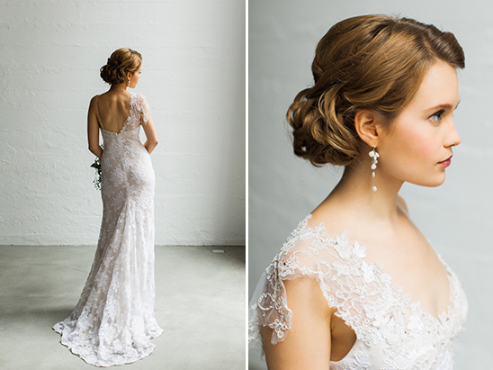 Bride in fitted lace wedding gown with elegant updo hairstyle