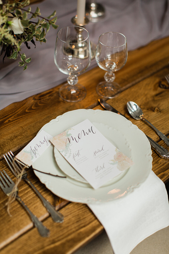 Elegant wedding table setting with menu and glassware