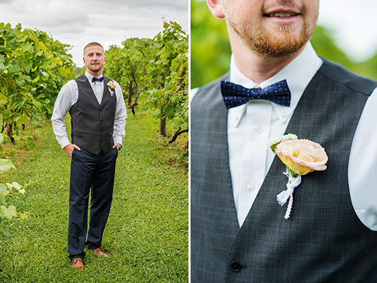 Wedding groom in vest and bow tie at vineyard portrait