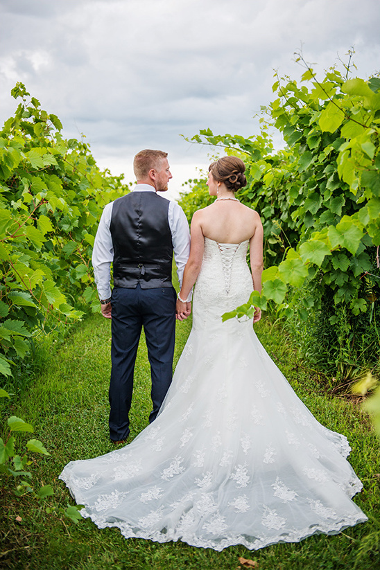 Romantic vineyard wedding bride and groom walk together