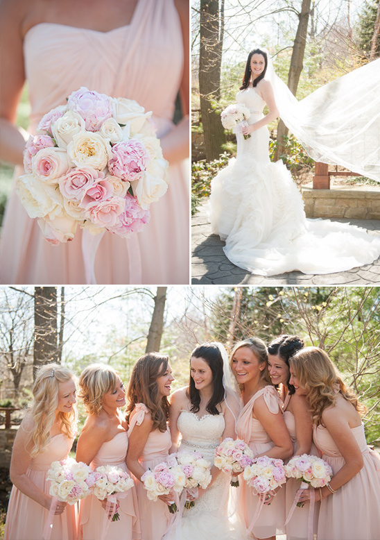 Blush wedding party with bride and bridesmaids holding flowers
