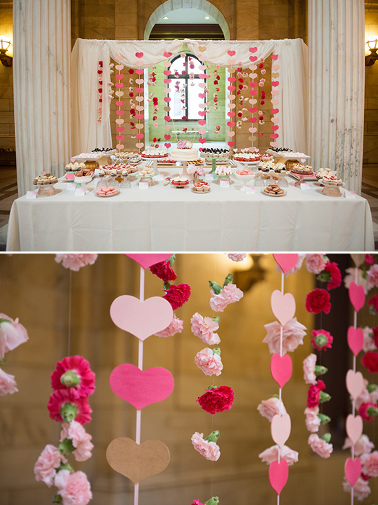 Wedding dessert table with heart decorations and flowers