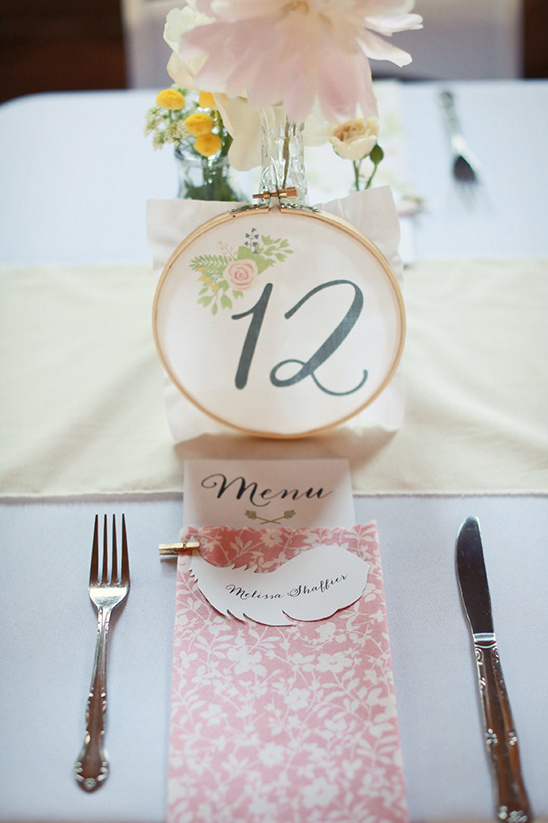 Elegant wedding table number twelve floral hoop decor