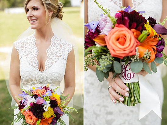 Smiling bride holds vibrant colorful wedding bouquet