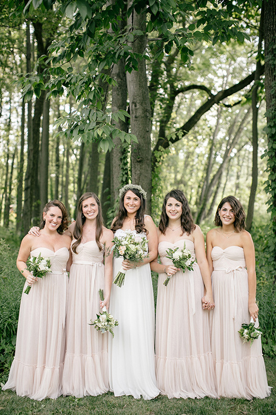 Bride with bridesmaids in forest wedding dresses photo