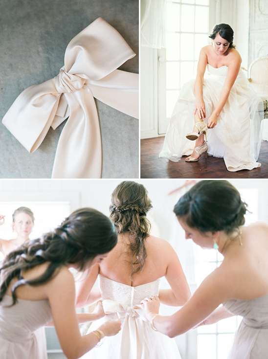 Bride preps for her wedding with dress and attendants