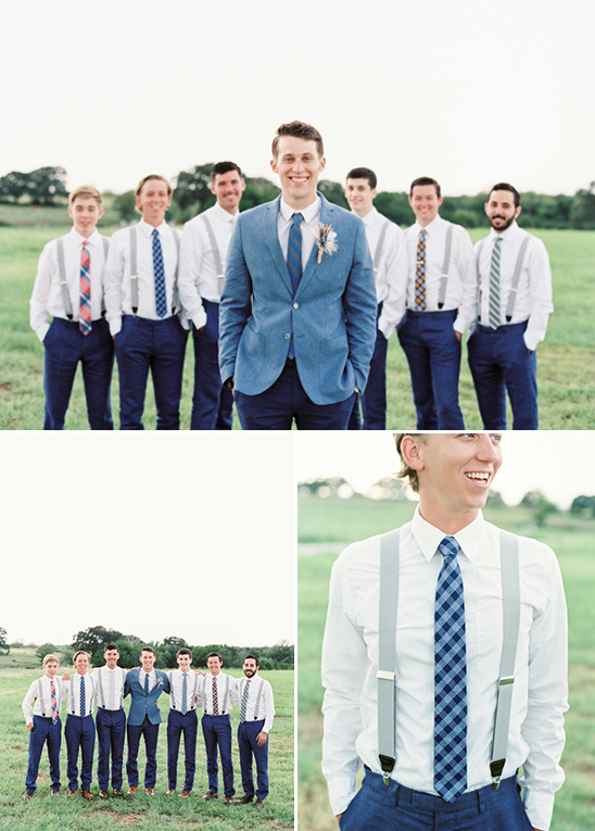 Groom and groomsmen wearing suspenders and ties outdoors