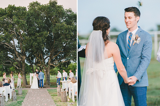 Outdoor wedding ceremony with bride and groom holding hands