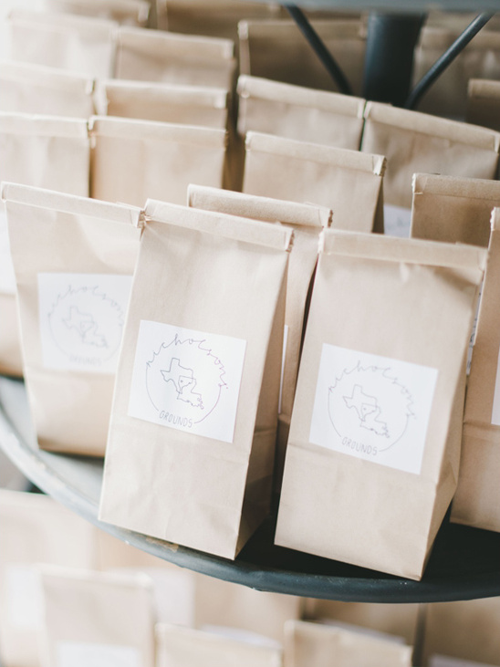 Brown paper bags of Nicholson Grounds coffee beans