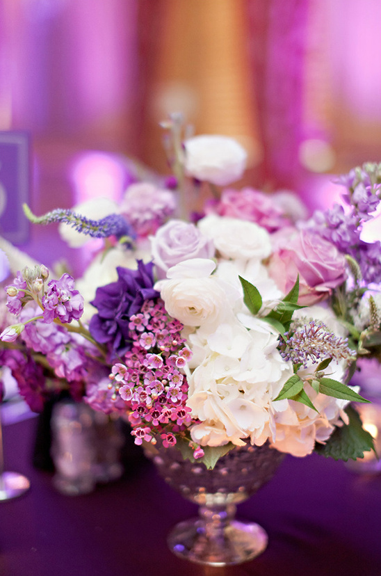 Elegant purple and white wedding flower arrangement