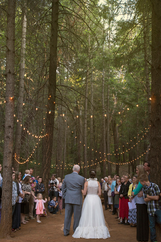 romantic forest ceremony complete with twinkle lights