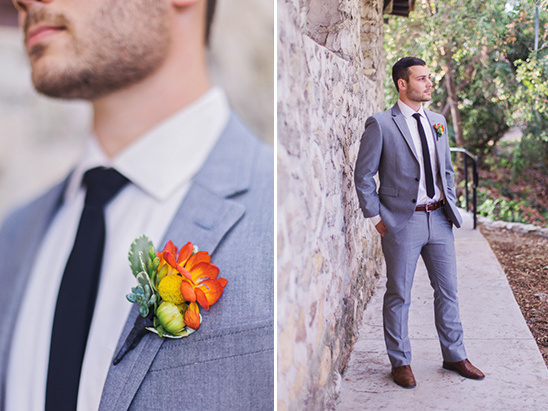 Man in grey suit with boutonniere outdoor portrait