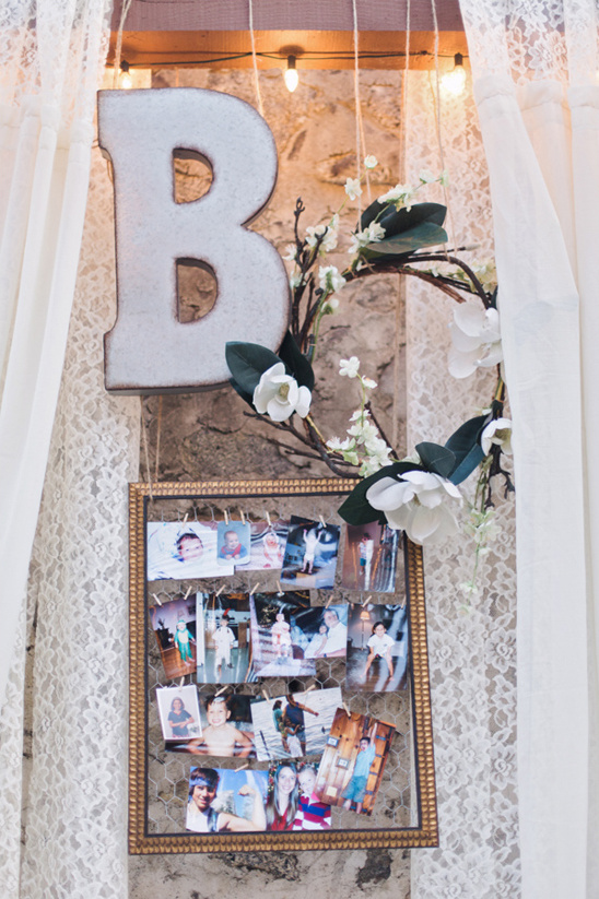 Wedding photo display with letter B and floral wreath