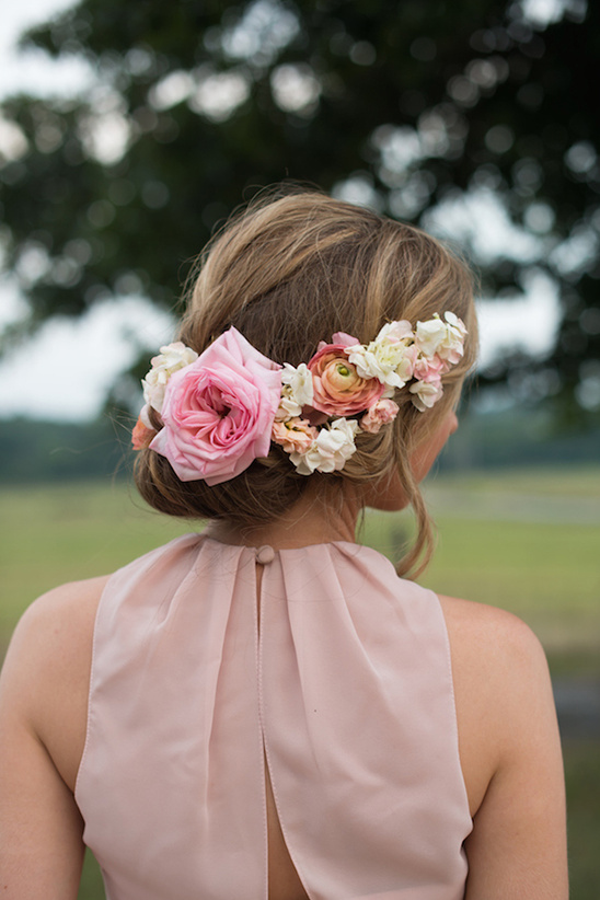 Woman with flower crown updo and blush dress