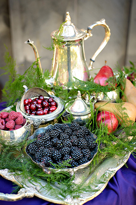 Silver tea set with fresh berries and pears display
