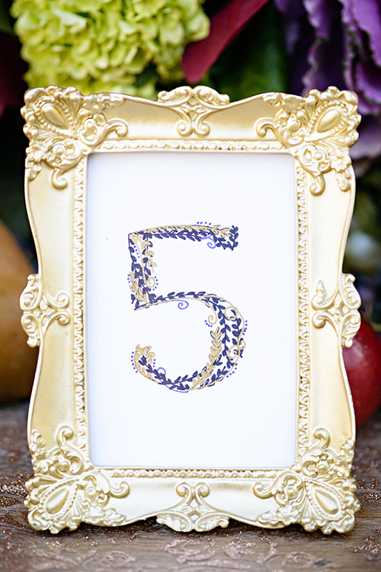 gold and purple table numbers
