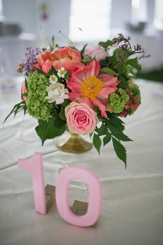 pink table number and bright centerpiece