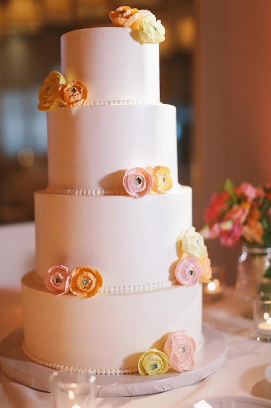 paper flower accented wedding cake