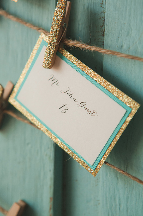 gold and teal escort card