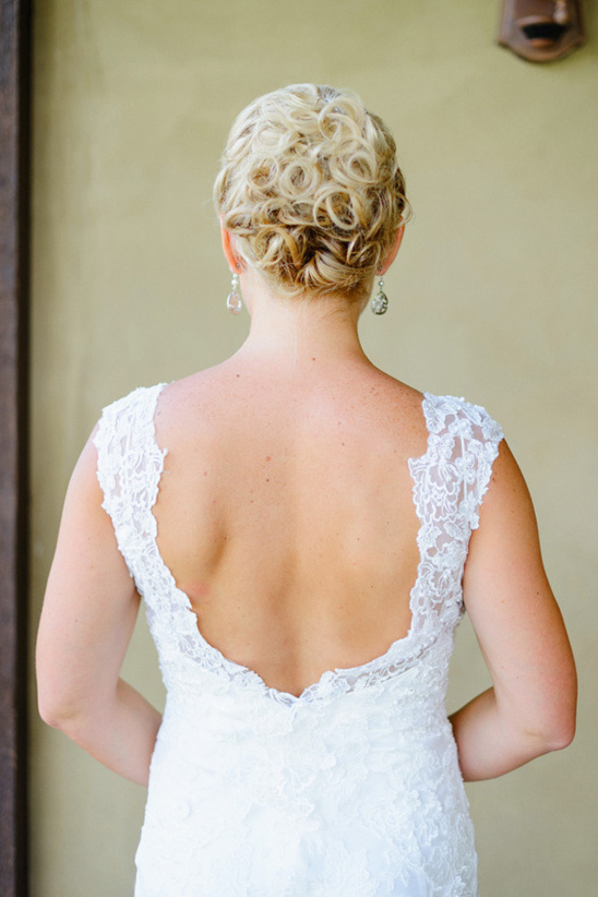 curley updo and back showcasing wedding dress