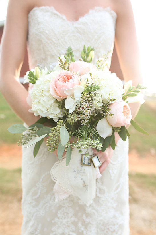 Bride holds pink white bouquet wedding photo charm