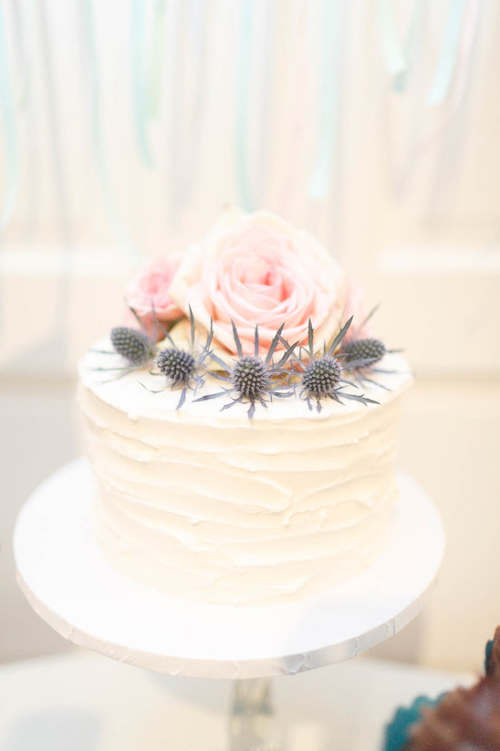 rose and thistle topped wedding cake