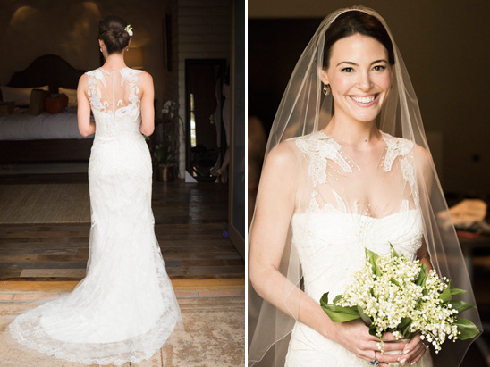 Bride in lace gown holding lily of the valley bouquet